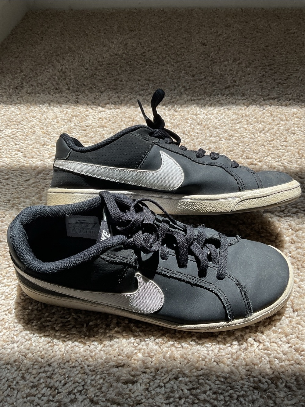 Nike Women’s Black Sneakers with White Swoosh
